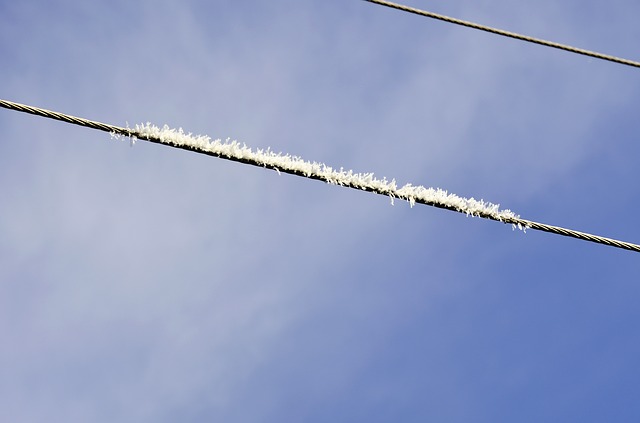 Ice on a power line in the middle of winter